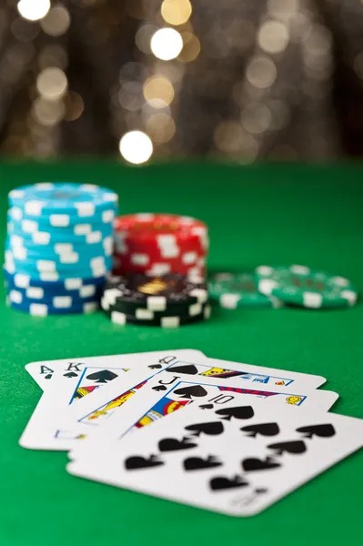 Casino Hold'em table layout with dealer and community cards visible